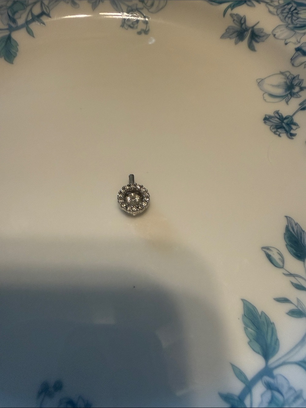 Round Halo diamond pendant - Silver not sure if white gold or silver.